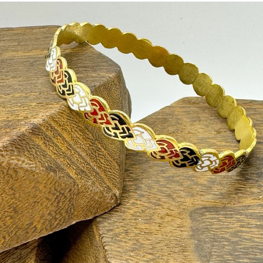 Gold tone heart bangle bracelet with red black white enamel inlay